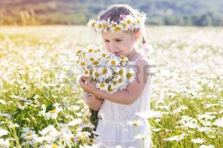 41068231-cute-little-smiling-girl-in-the-chamomile-field-in-spring.jpg